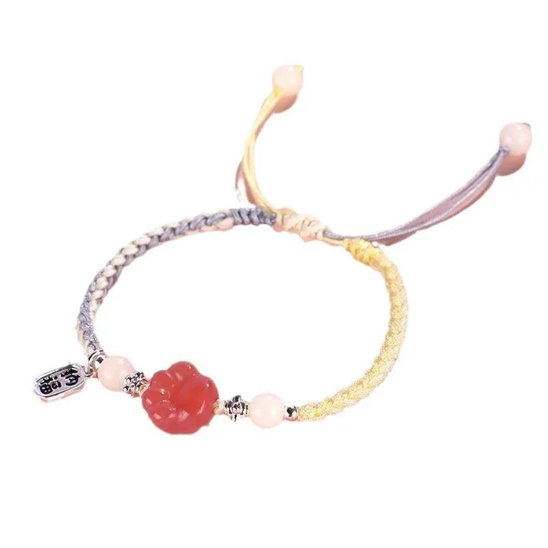 Handmade red cat's paw charm bracelet with woven band in pink or yellow colour for couples