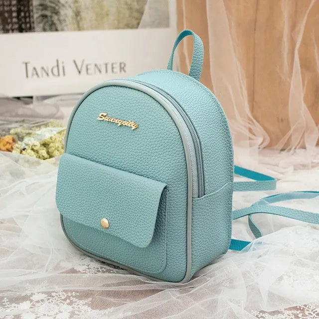 Black PU leather small women's backpack with zipper, shown as a shoulder bag.