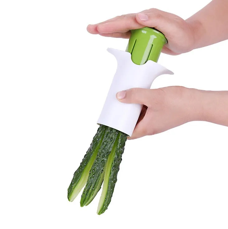 White kitchen vegetable and fruit slicer with multiple stainless steel blades.