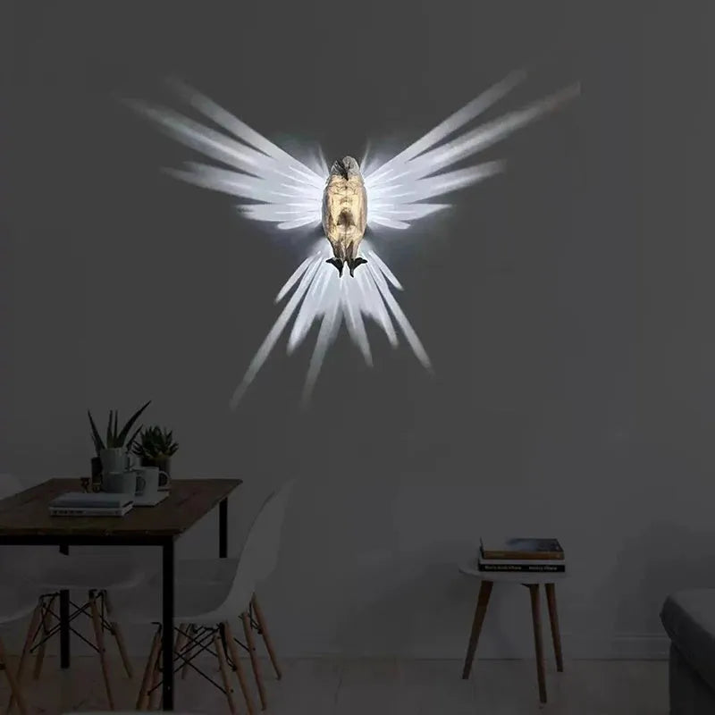 3D printed plastic eagle wall lamp projecting animal silhouette for home decor.