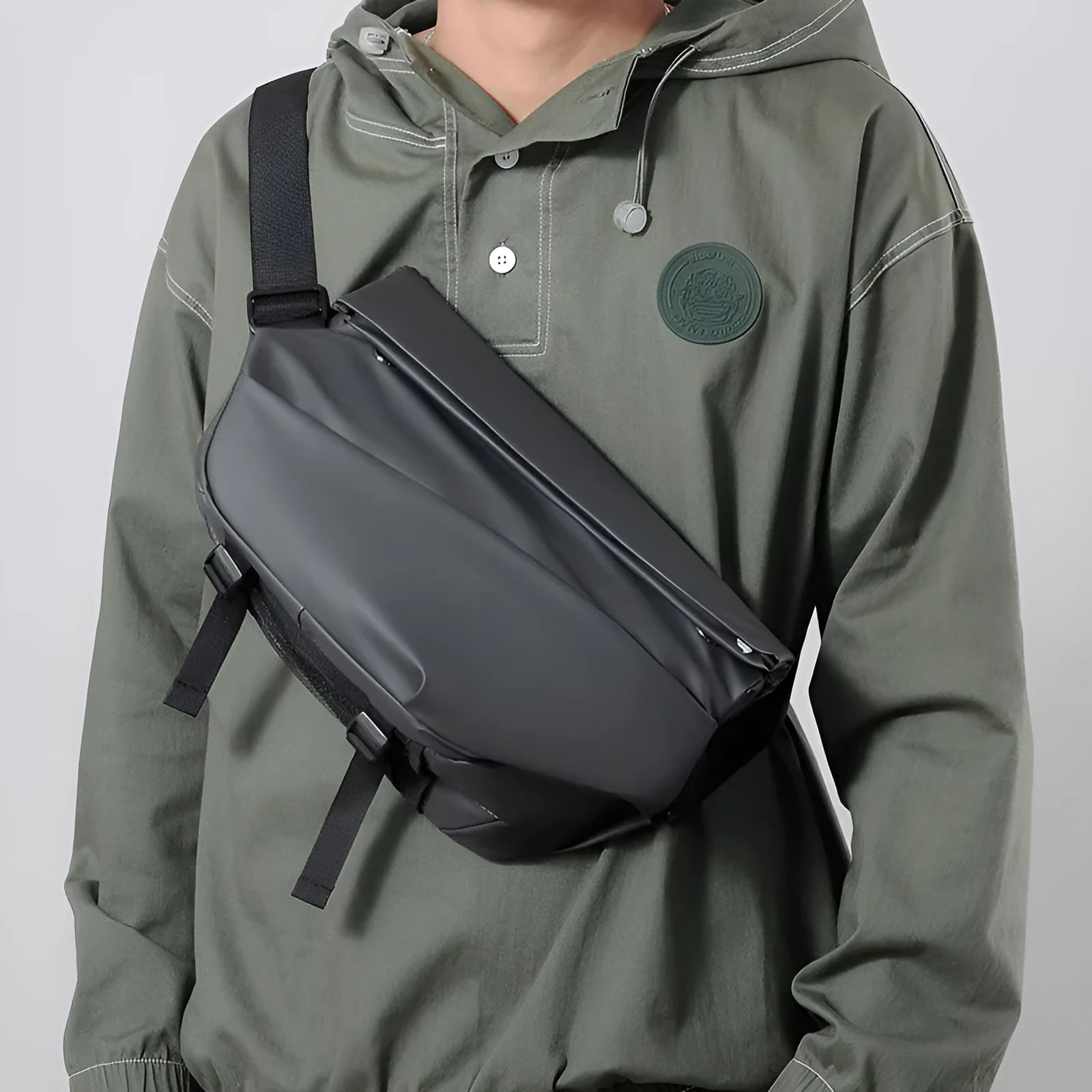 Grey PU leather men's crossbody sling backpack with zip and adjustable strap.