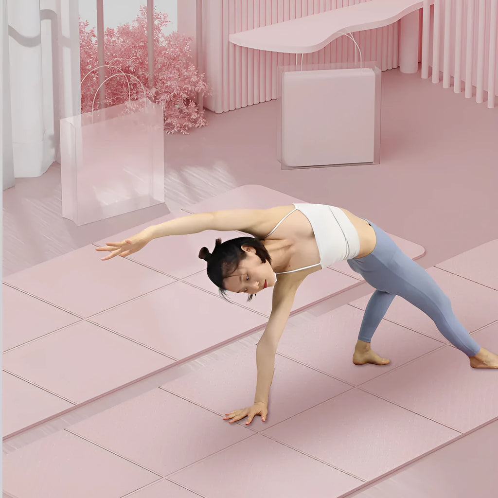 A folded and unfolded purple TPE gymnastic mat on a wooden floor.