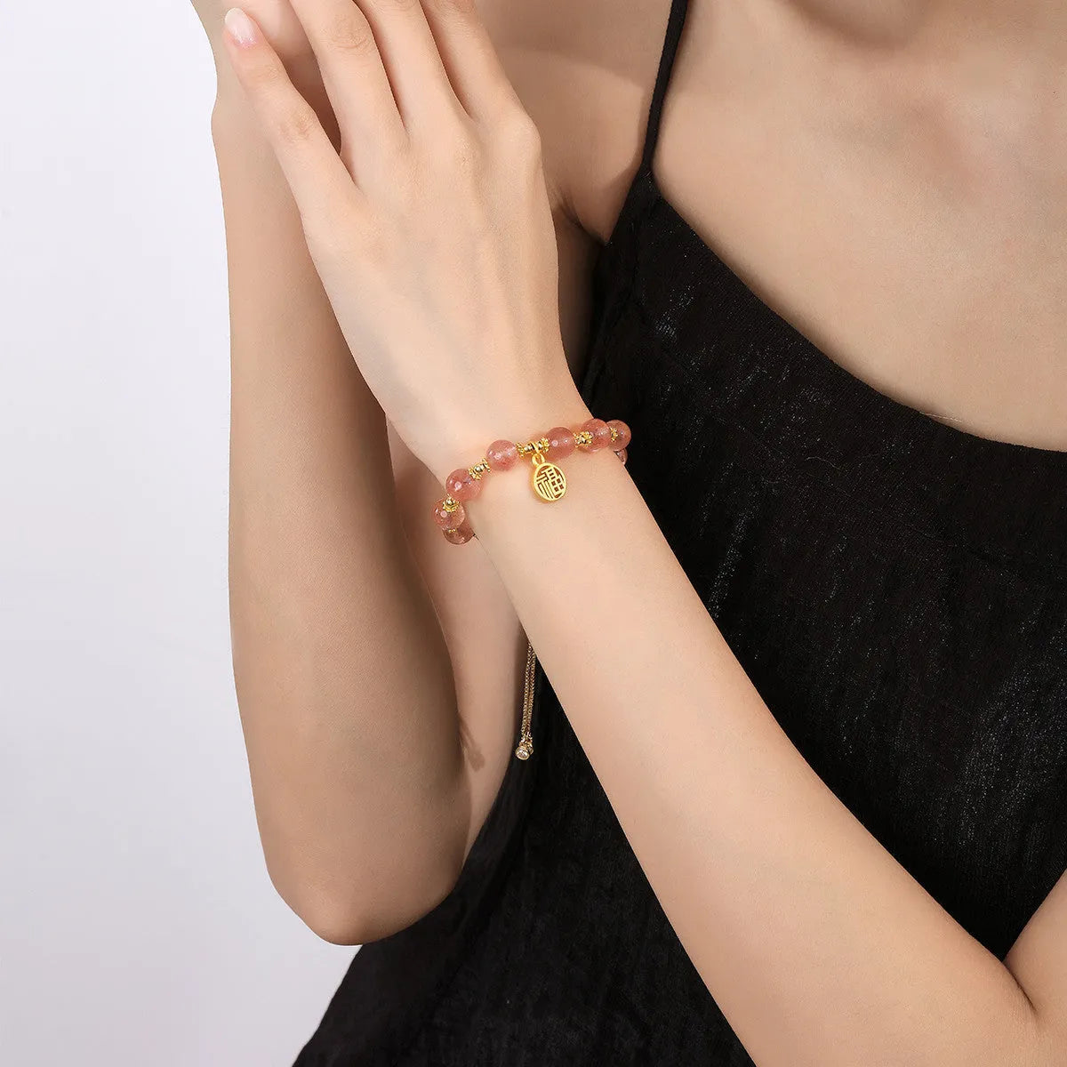 Strawberry quartz crystal bracelet with geometric shapes and fu character symbols