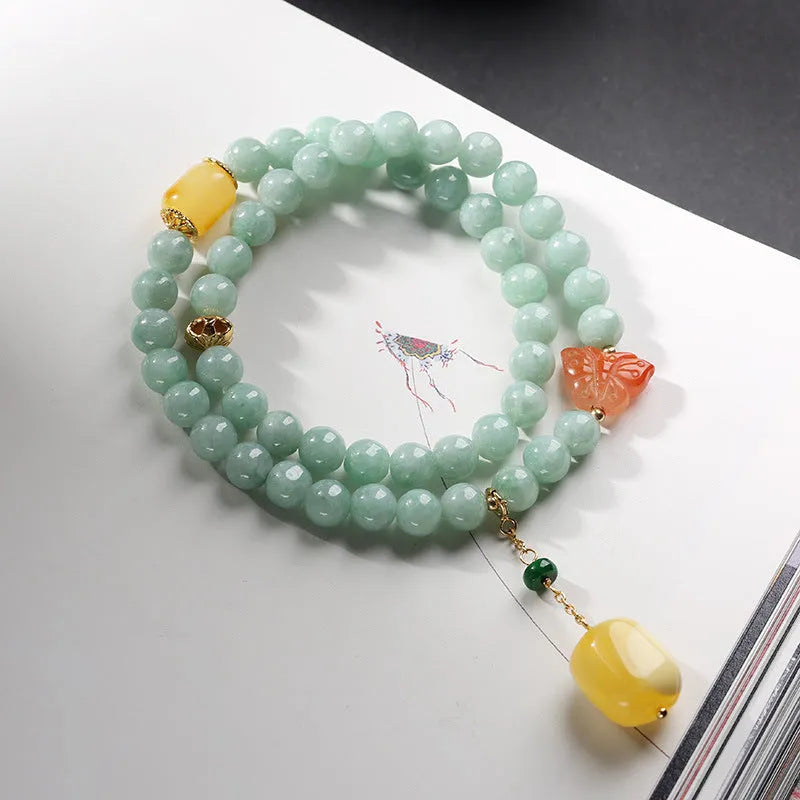Double-layer women's bracelet with jade round beads and hanging beeswax barrel beads in retro geometry design
