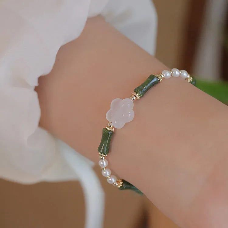 Chinese style olivine bracelet with Hetian jade and copper shell pearls featuring bamboo joint design