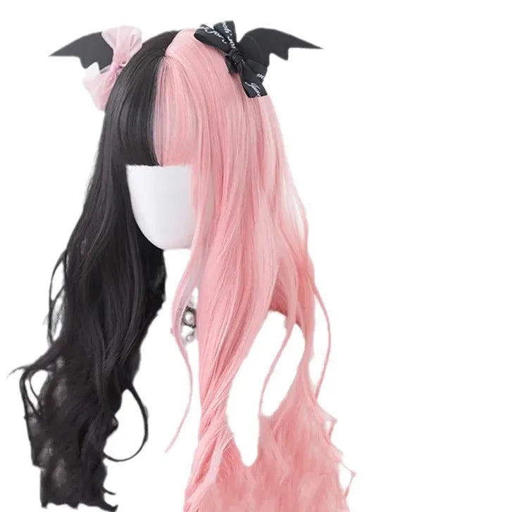 Harajuku Japanese Lolita style long curly black and pink wig with bangs on a wig stand.