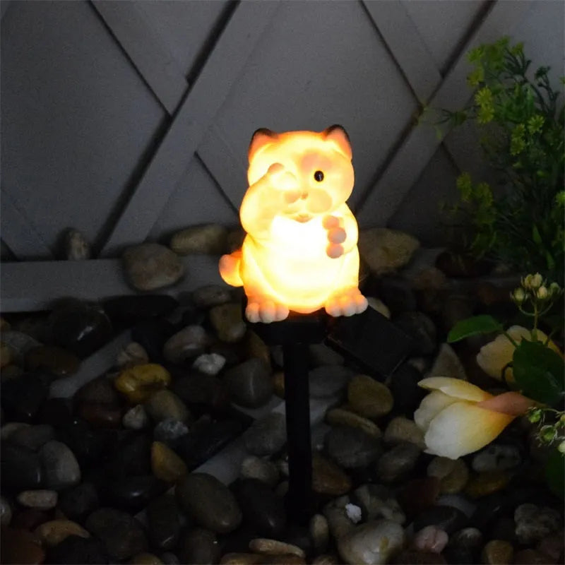 Brown resin cat-shaped solar garden light with LED, for courtyard decoration.