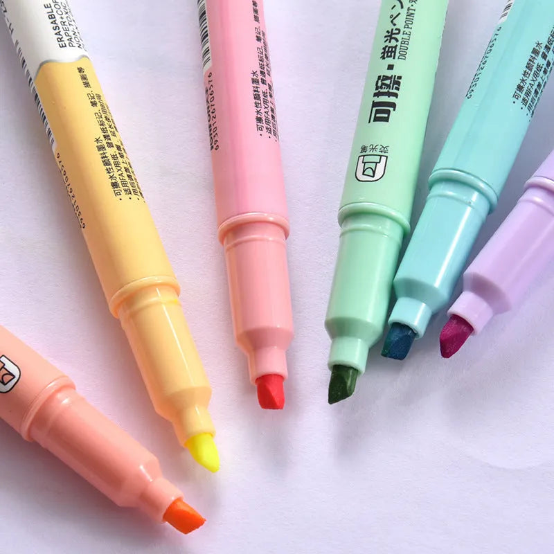 Six double-headed fluorescent marker pens in plastic casing with various coloured barrels