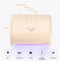 9W black LED UV nail lamp with dual light source and timer buttons on a white surface