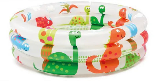 INTEX inflatable baby pool with dinosaur and volcano print, 61cm round, deflated on grass
