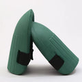 Pair of rectangular EVA foam knee pads in chosen colour on a garden surface