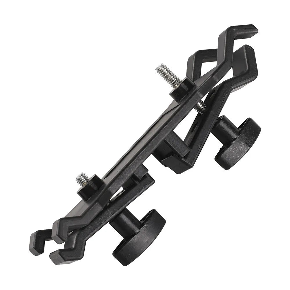 Black ABS plastic umbrella clip attached to an Apple tripod for camera rain protection.