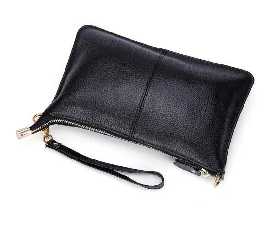 Lady's cowhide slant handbag with a hand strap and long shoulder strap shown in a selected colour.