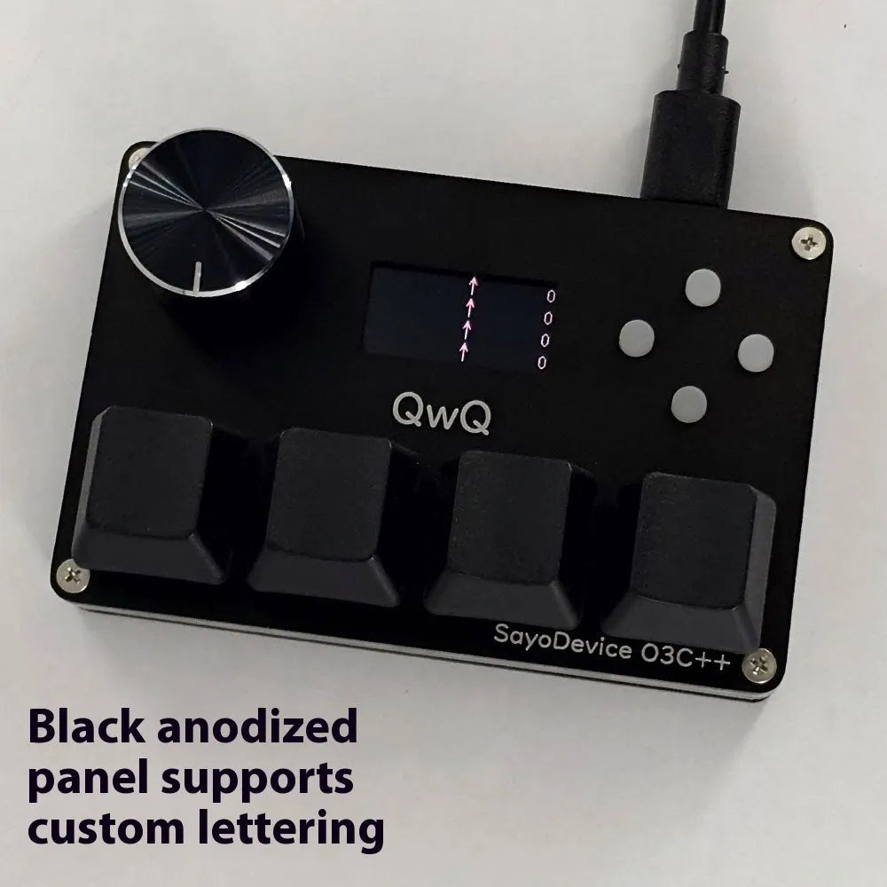 Magnetic axis gaming numeric keypad with colour screen, control knob, and RGB backlighting on a desk.