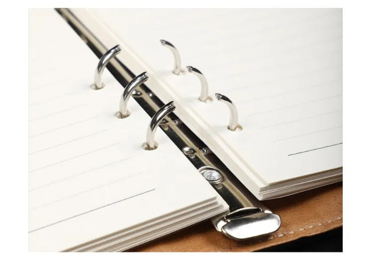 A5 hardcover PU binder notebook with metal buckle clip, shown in multiple colours.