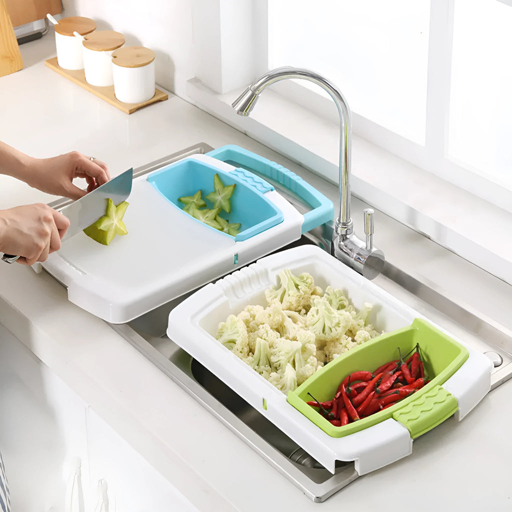 Green multi-function kitchen cutting board with integrated draining basket mounted on sink edge