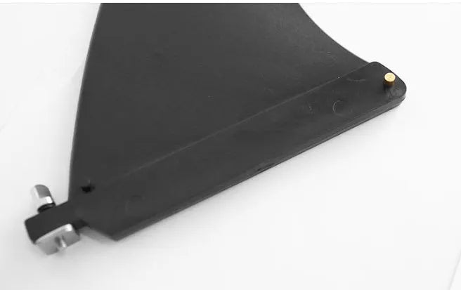 SUP paddle with removable fish fin component showing screw attachment point