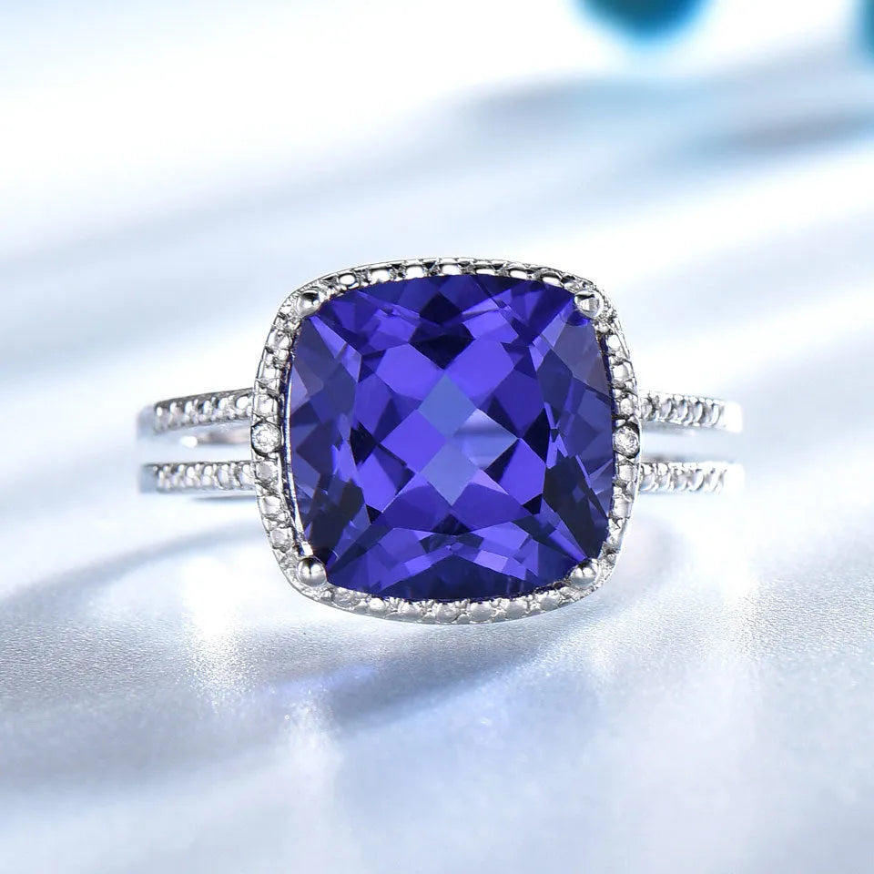 Women's sterling silver ring with a blue tanzanite gemstone.