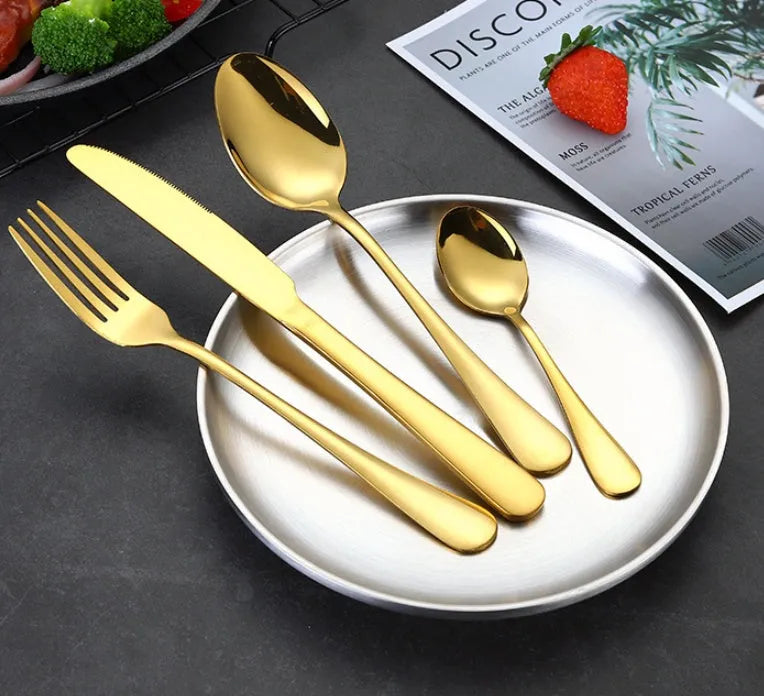 24 piece stainless steel tableware set showing knives, forks, and spoons in multiple colour finishes