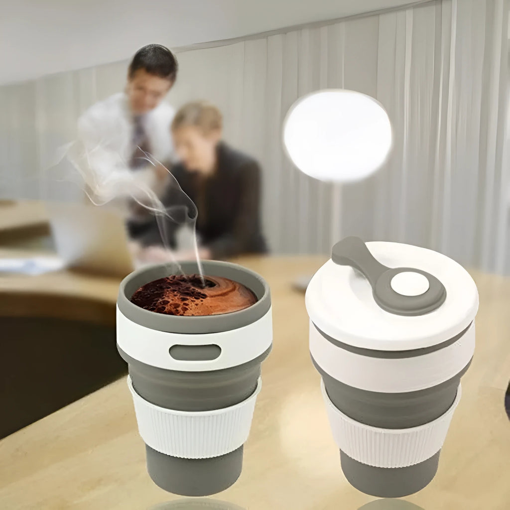 Green collapsible silicone travel cup shown both expanded and folded to 6cm height