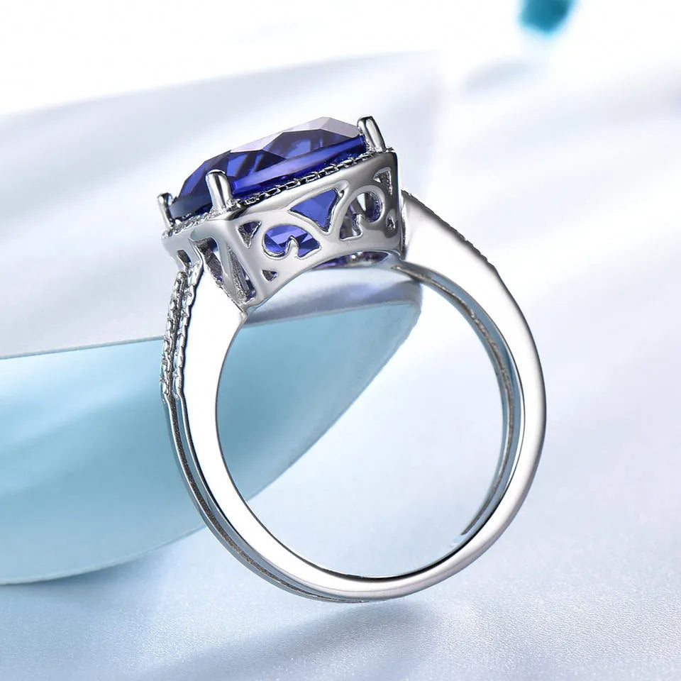 Women's sterling silver ring with a blue tanzanite gemstone.