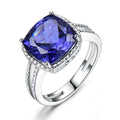 Women's sterling silver ring with a blue tanzanite gemstone.