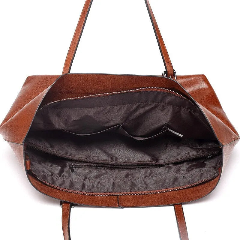 Brown leather crossbody handbag with multiple internal compartments showing dimensions 30cm wide by 37cm high.