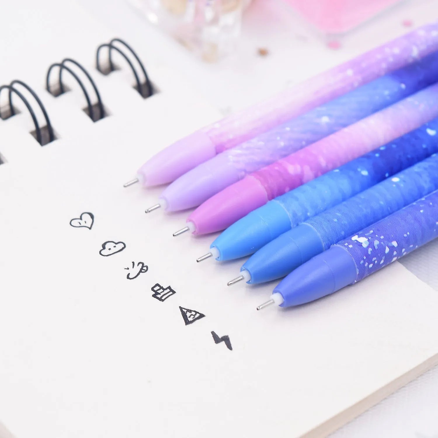 Box containing 12 constellation-themed quick-drying gel pens with plastic barrels