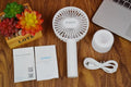 White ORICO FH1 portable USB rechargeable handheld desk fan with three-speed settings.