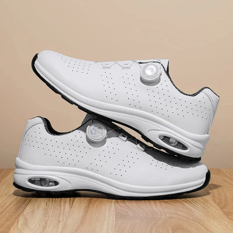 Low-top black and white mesh tennis shoes with cross-strap design and flat composite sole