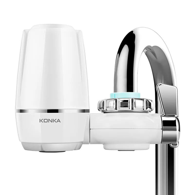 White plastic faucet water filter with switch lever and ceramic cartridge, shown with universal tap adapters.