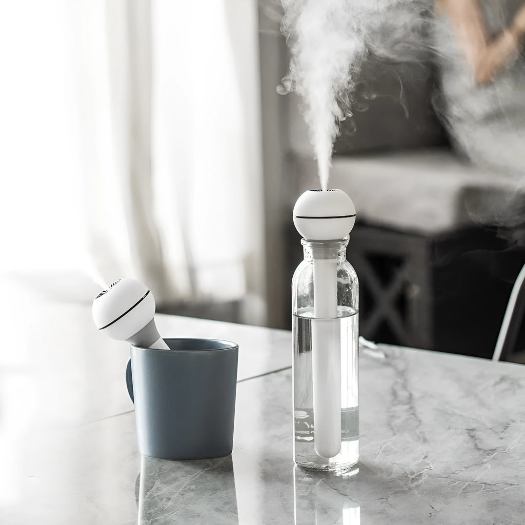 Columnar pink and white magic wand ultrasonic humidifier with USB cable