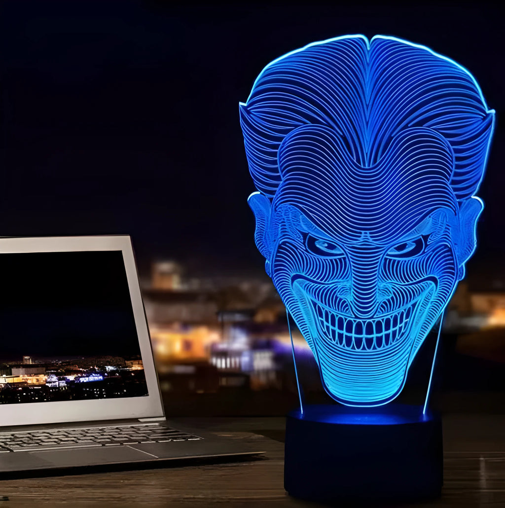 USB-powered 3D acrylic LED table lamp with remote control on a desk, displaying colourful gradient lighting.