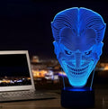 USB-powered 3D acrylic LED table lamp with remote control on a desk, displaying colourful gradient lighting.