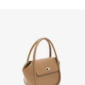 A wing-shaped cow leather women's tote bag with a cross-body strap and latch closure in a choice of colours.