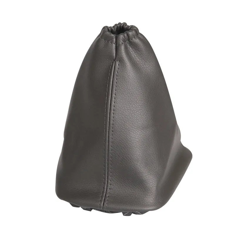 Black leather gear shift dust cover for Toyota Corolla measuring 15.2cm by 12.9cm