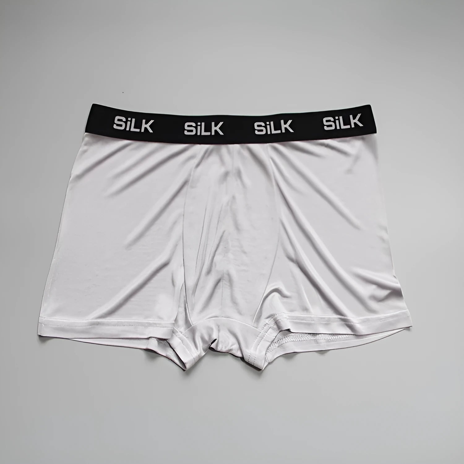 Men's navy blue silk shorts with mid-waist design on hanger