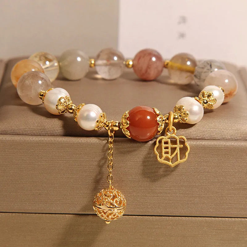 Women's adjustable crystal pearl bracelet with four pearls and Chinese Cai charm in natural hair colours