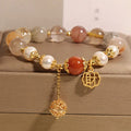 Women's adjustable crystal pearl bracelet with four pearls and Chinese Cai charm in natural hair colours