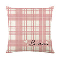 Red and white plaid heart printed pillow cover on a cushion, 45 centimetres square.