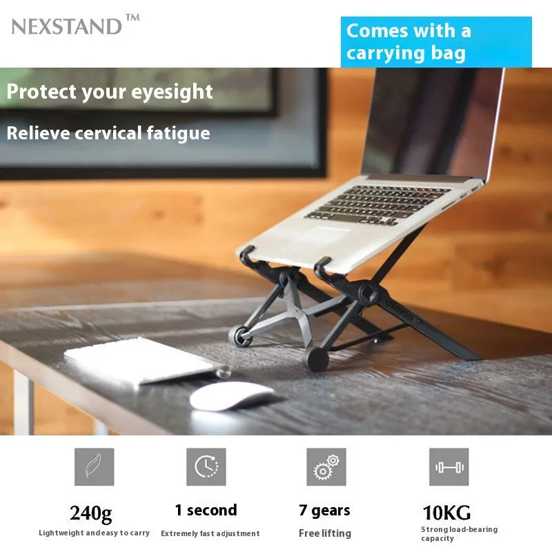 Sagacious black portable folding laptop stand bracket on a desk next to a laptop.