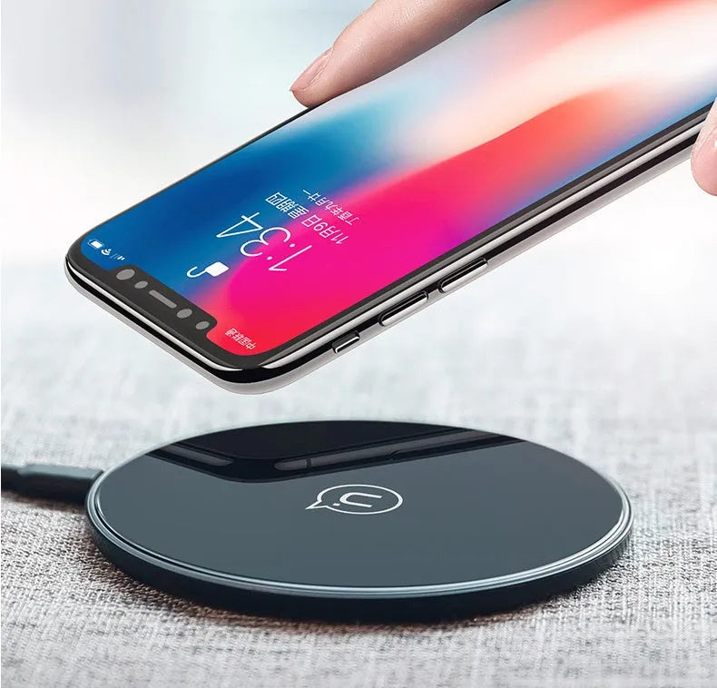 Glass disc wireless charger showing black and white colour options with charging indicator