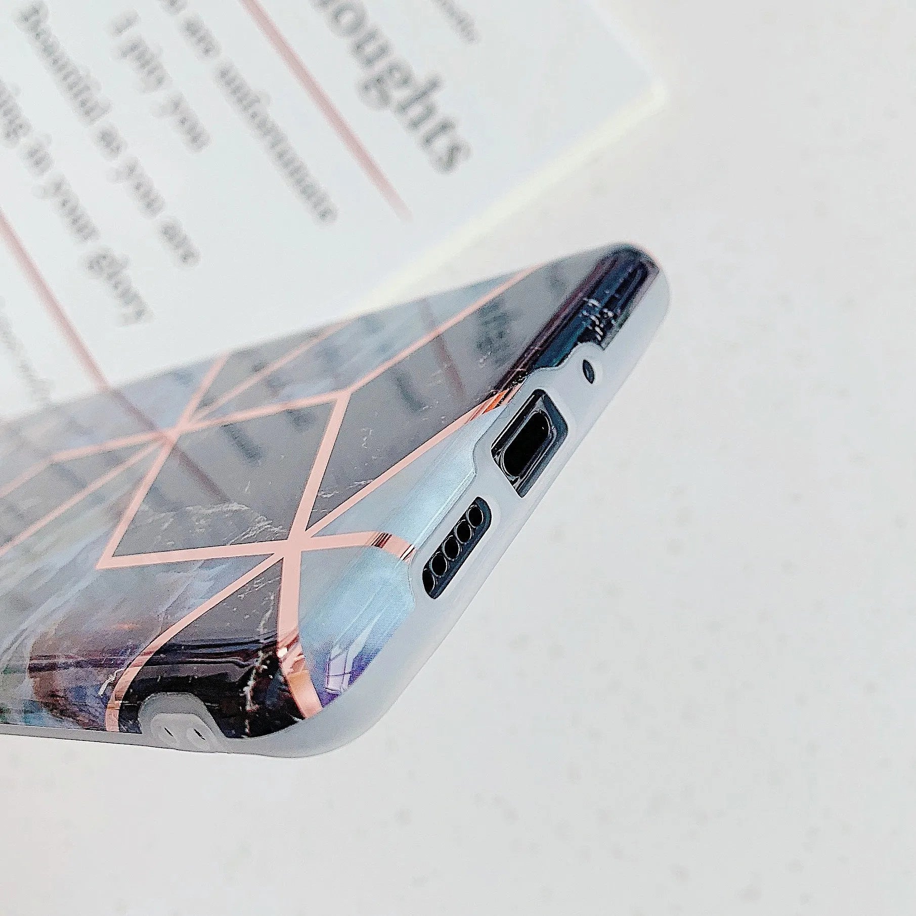Electroplated marble pattern TPU back cover case for a mobile phone.