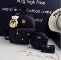 Women's 3-piece floral print PU leather bag set showing backpack, shoulder bag, and card purse in pink.