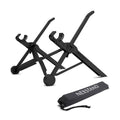 Sagacious black portable folding laptop stand bracket on a desk next to a laptop.