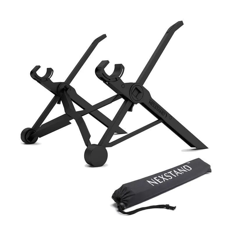 Sagacious black portable folding laptop stand bracket on a desk next to a laptop.