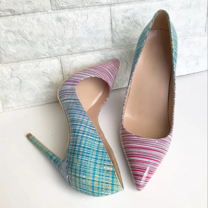 Women's pink and blue gradient patent leather pointed toe stiletto heels on a white background.