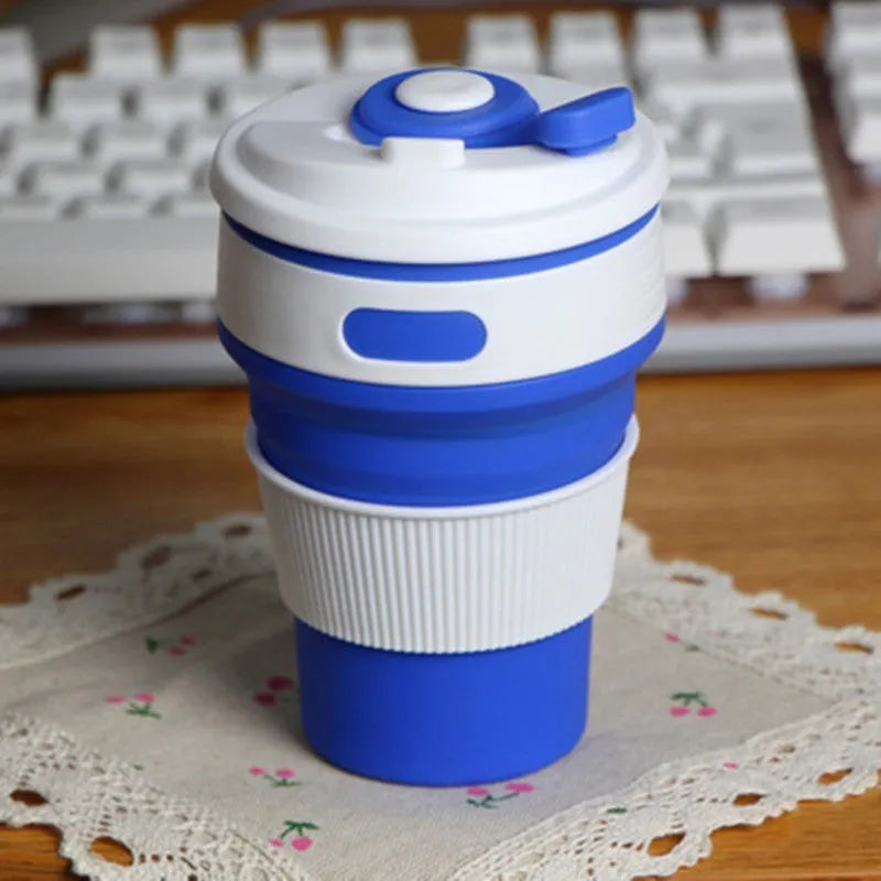 Green collapsible silicone travel cup shown both expanded and folded to 6cm height
