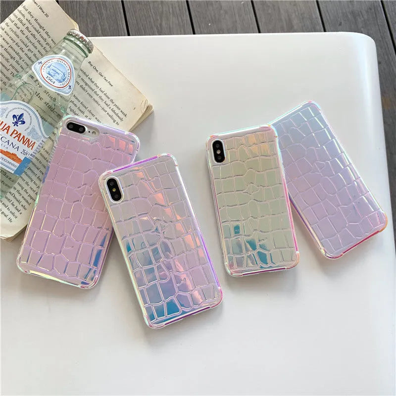 Silver glossy laser design silicone case for iPhone on a table.