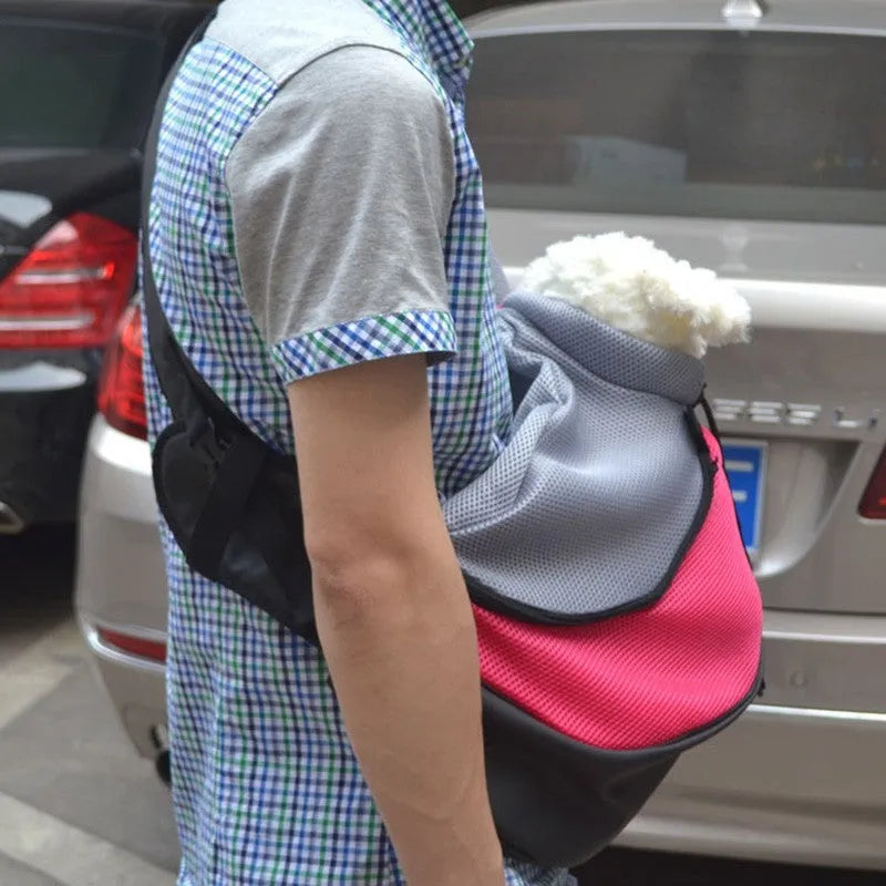 Blue padded pet backpack for a small dog, showing backpack straps and mesh ventilation panel.